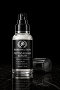 Spartha Skin Tattoo Repair Serum on reflective black surface
